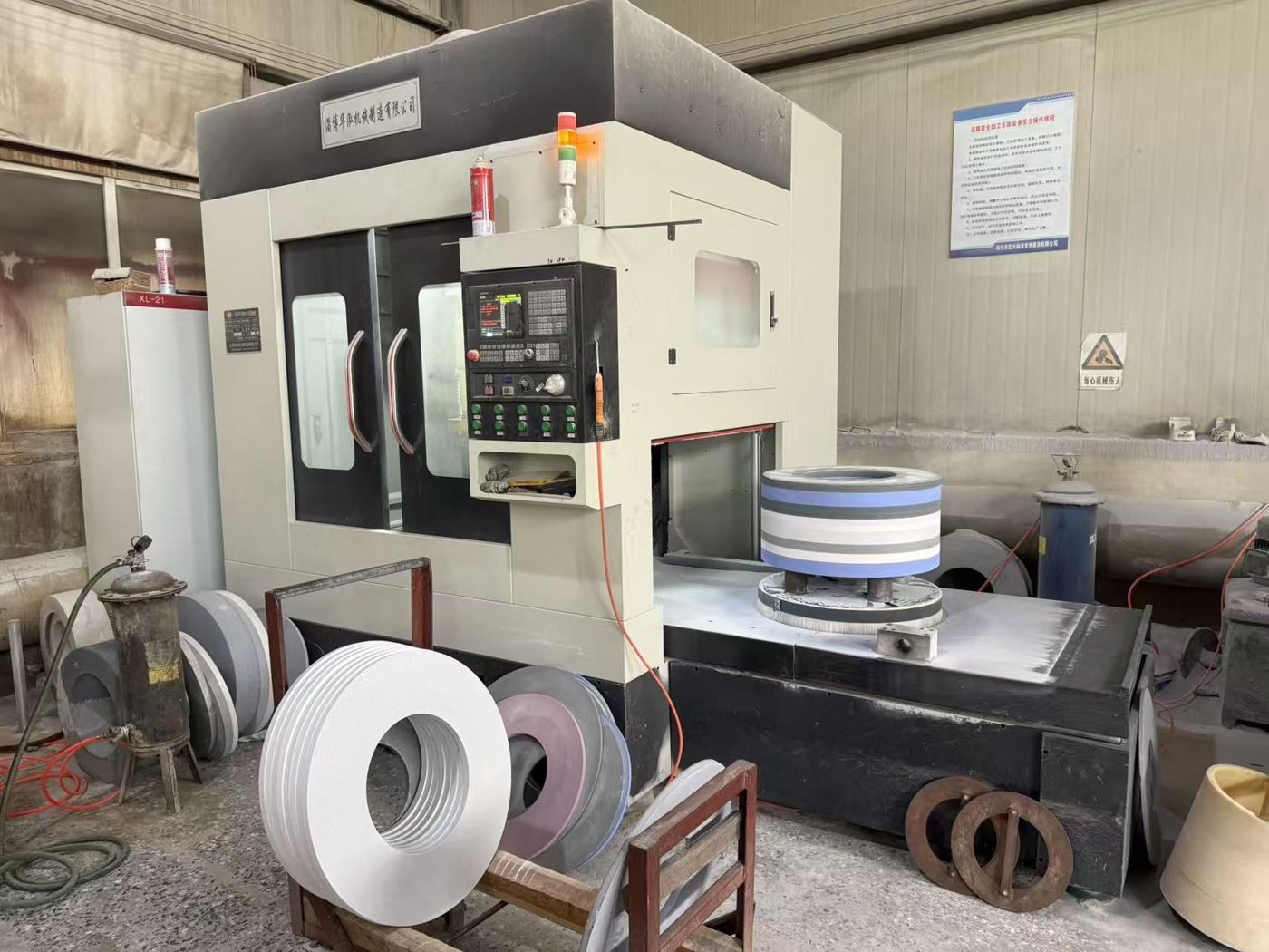 CNC machining center finishing a grinding wheel